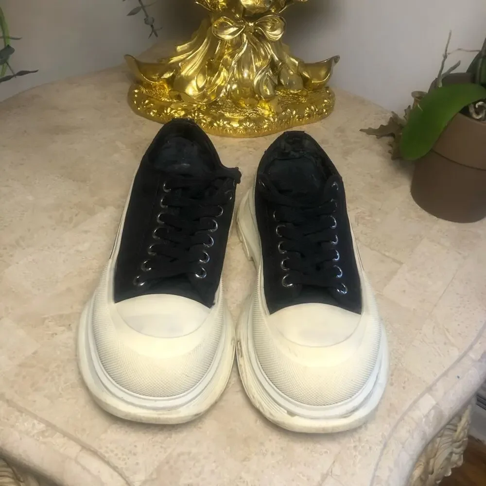 Alexander McQueen black and white platform chucks.